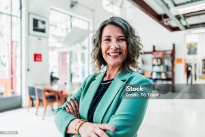 Portrait of mature woman at library